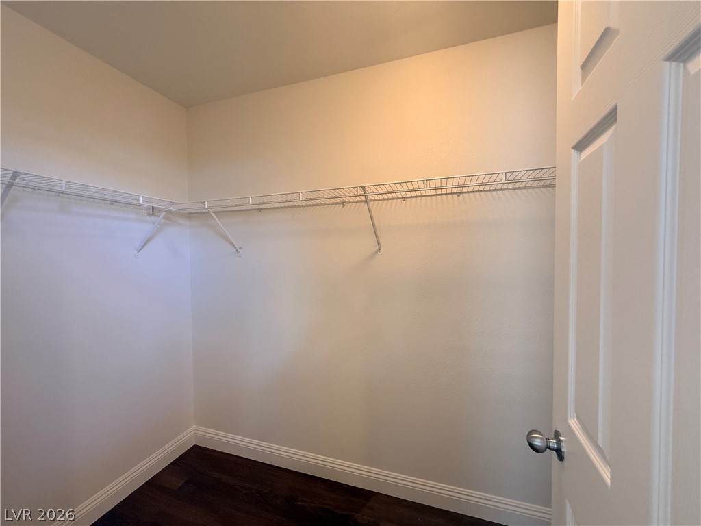 11953 Fairfax Ridge Street Las Vegas, NV 89183 - Photo 28 of 32 Streamlined wire shelving provides ample storage solutions within this functional walk-in closet.