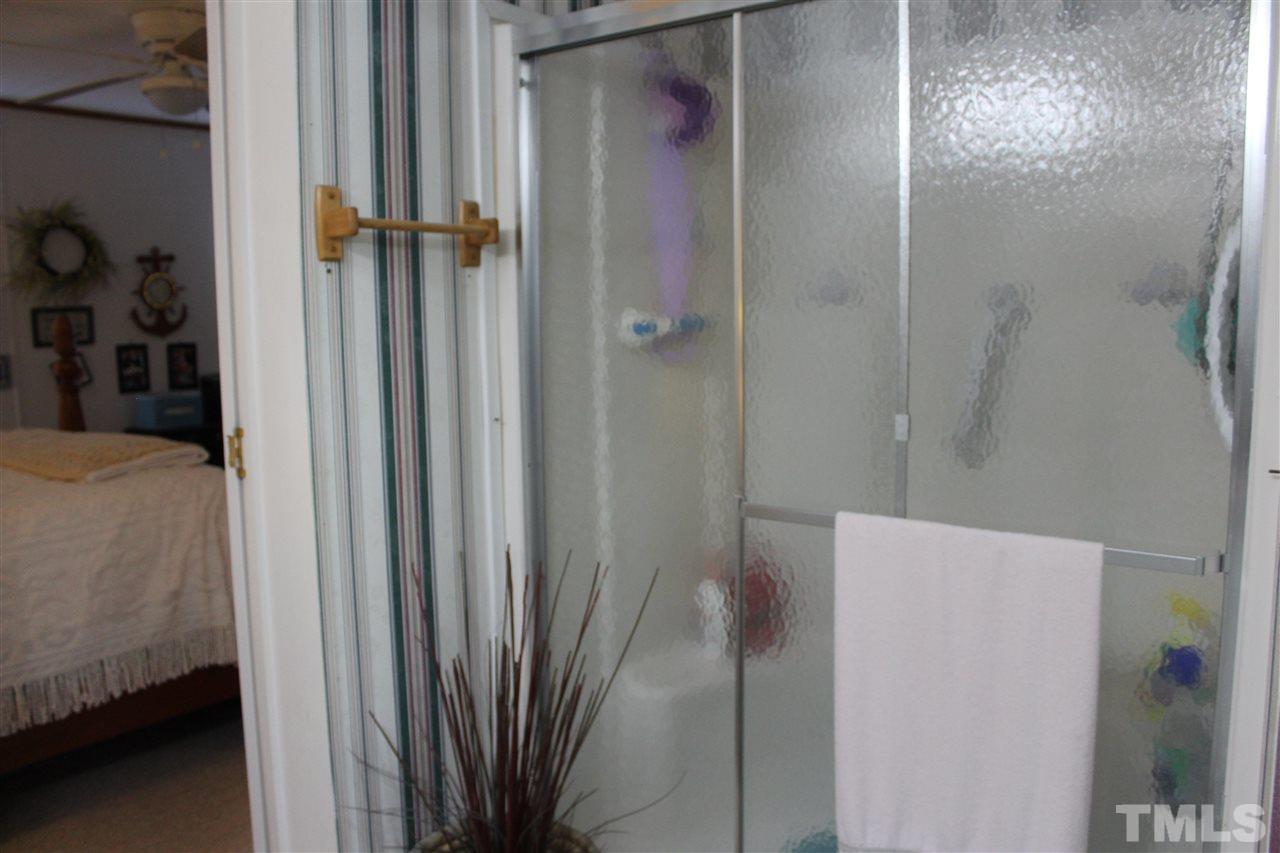 141 Waters Edge Road Henderson, NC 27537 - Photo 12 of 30 a bathroom with a shower