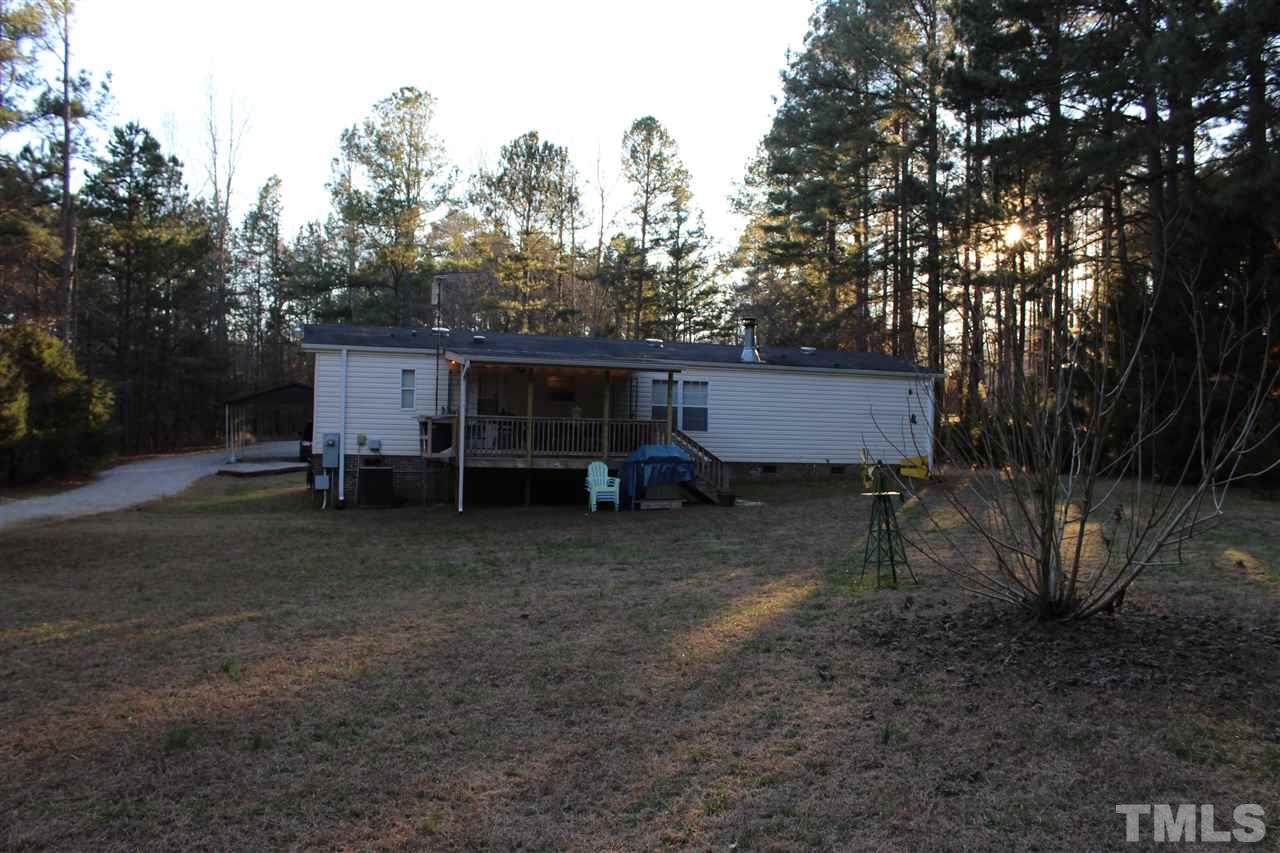 141 Waters Edge Road Henderson, NC 27537 - Photo 21 of 30 a view of a house with a yard and garage