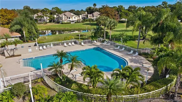 a view of a swimming pool with a patio