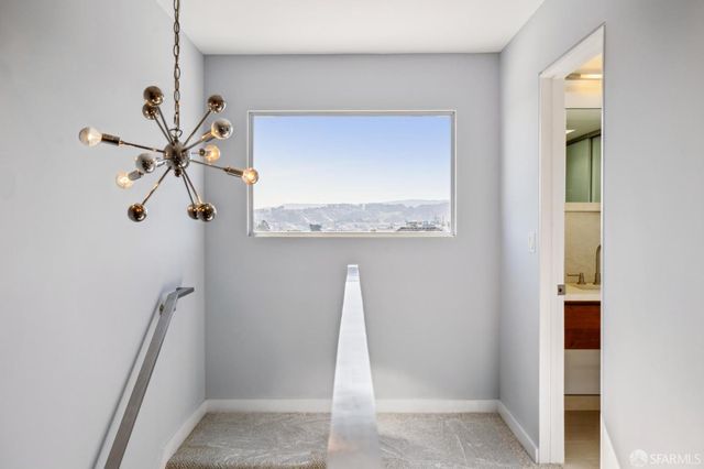 a bedroom with a bed and a chair