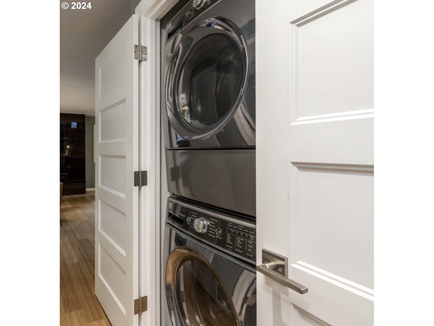 4432 Northwest Barnes Road Portland, OR 97210 - Photo 25 of 36 a view of a storage and utility room with washer and dryer