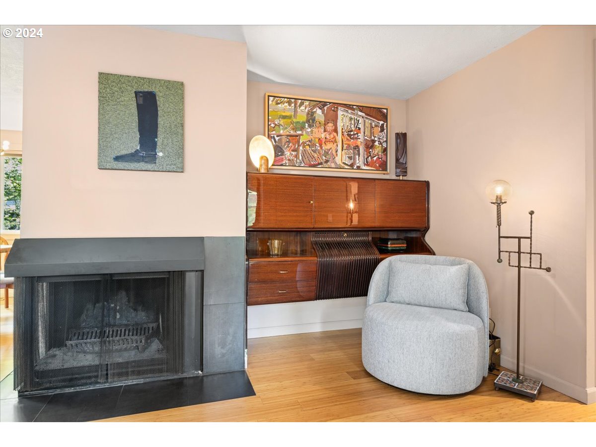 4432 Northwest Barnes Road Portland, OR 97210 - Photo 8 of 36 a living room with furniture and a fireplace