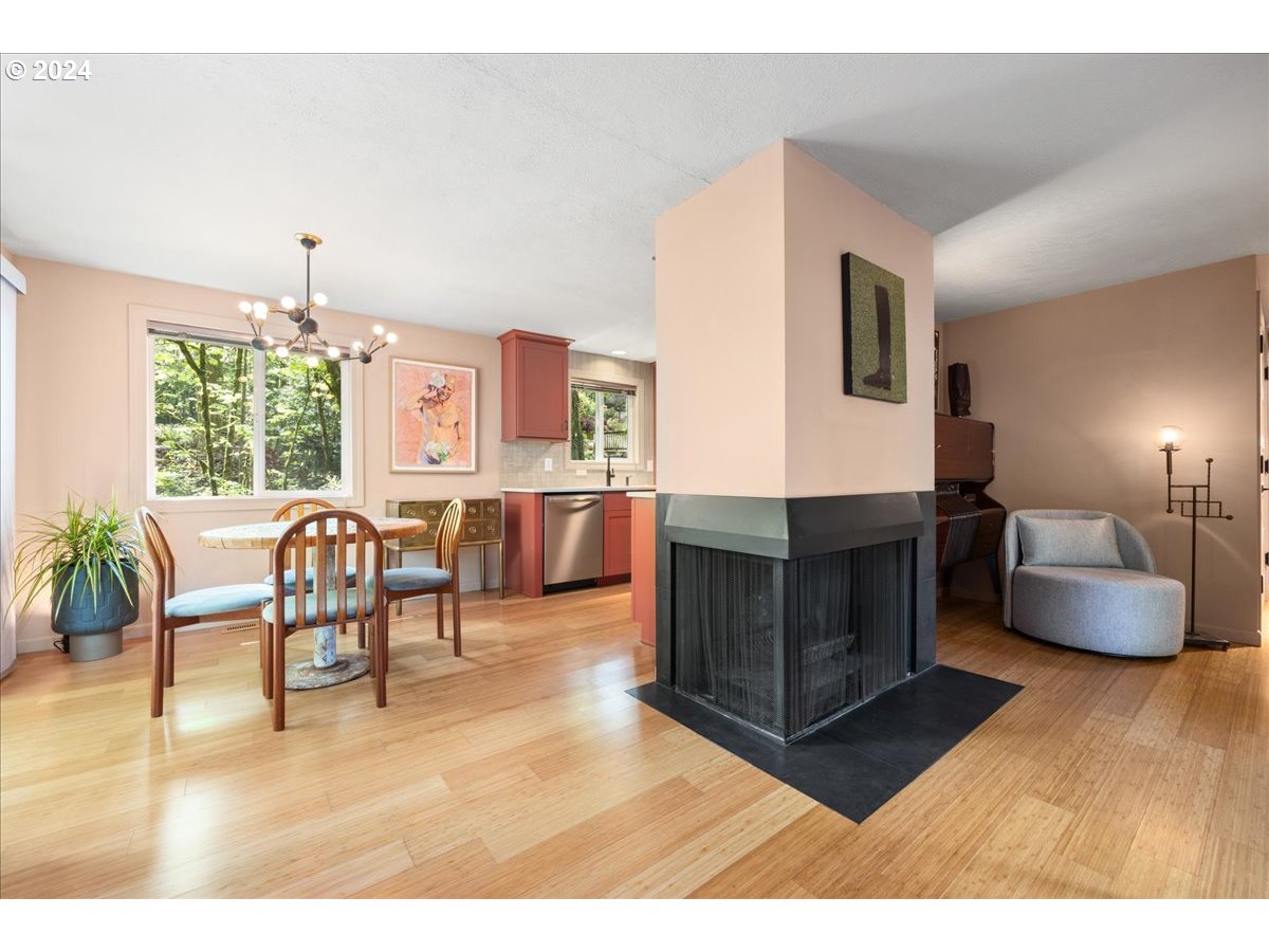 4432 Northwest Barnes Road Portland, OR 97210 - Photo 9 of 36 a living room with furniture and a wooden floor
