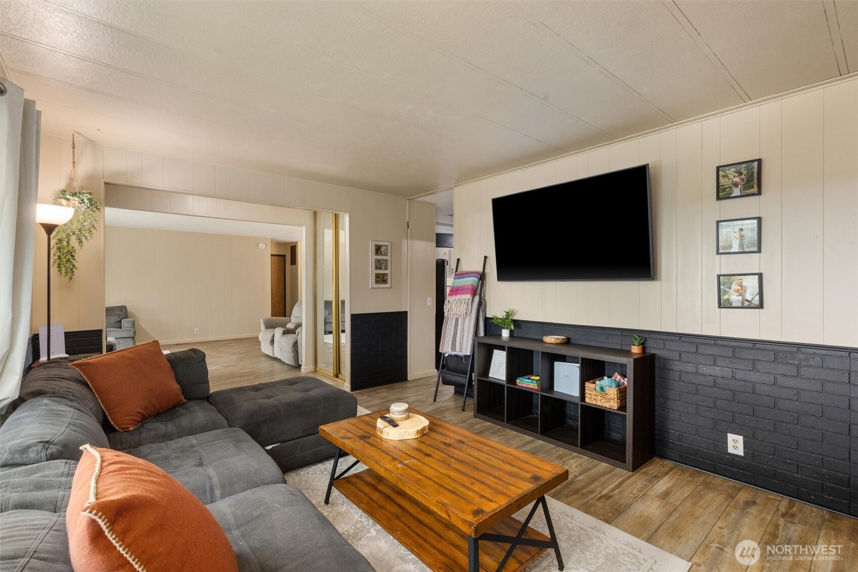 14601 Jim Creek Road Arlington, WA 98223 - Photo 14 of 35 a living room with furniture and a flat screen tv