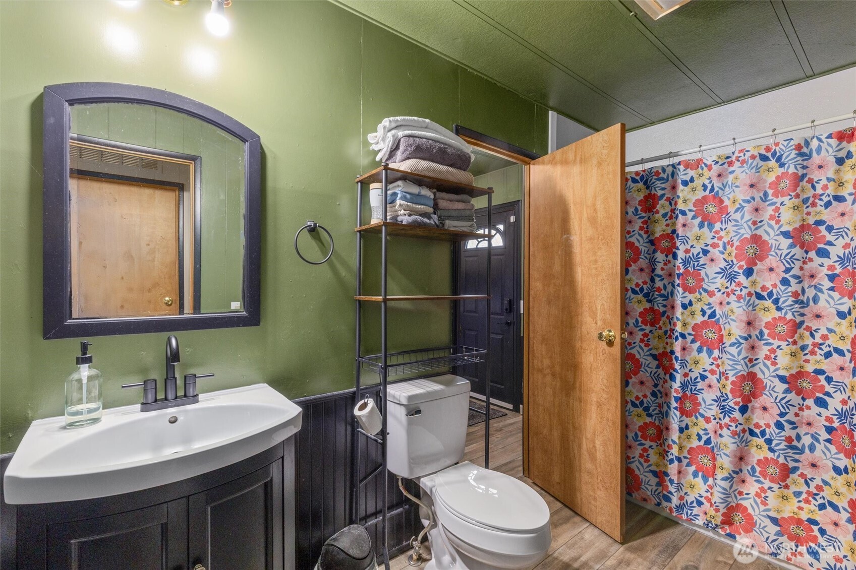 14601 Jim Creek Road Arlington, WA 98223 - Photo 20 of 35 a bathroom with a toilet sink and mirror
