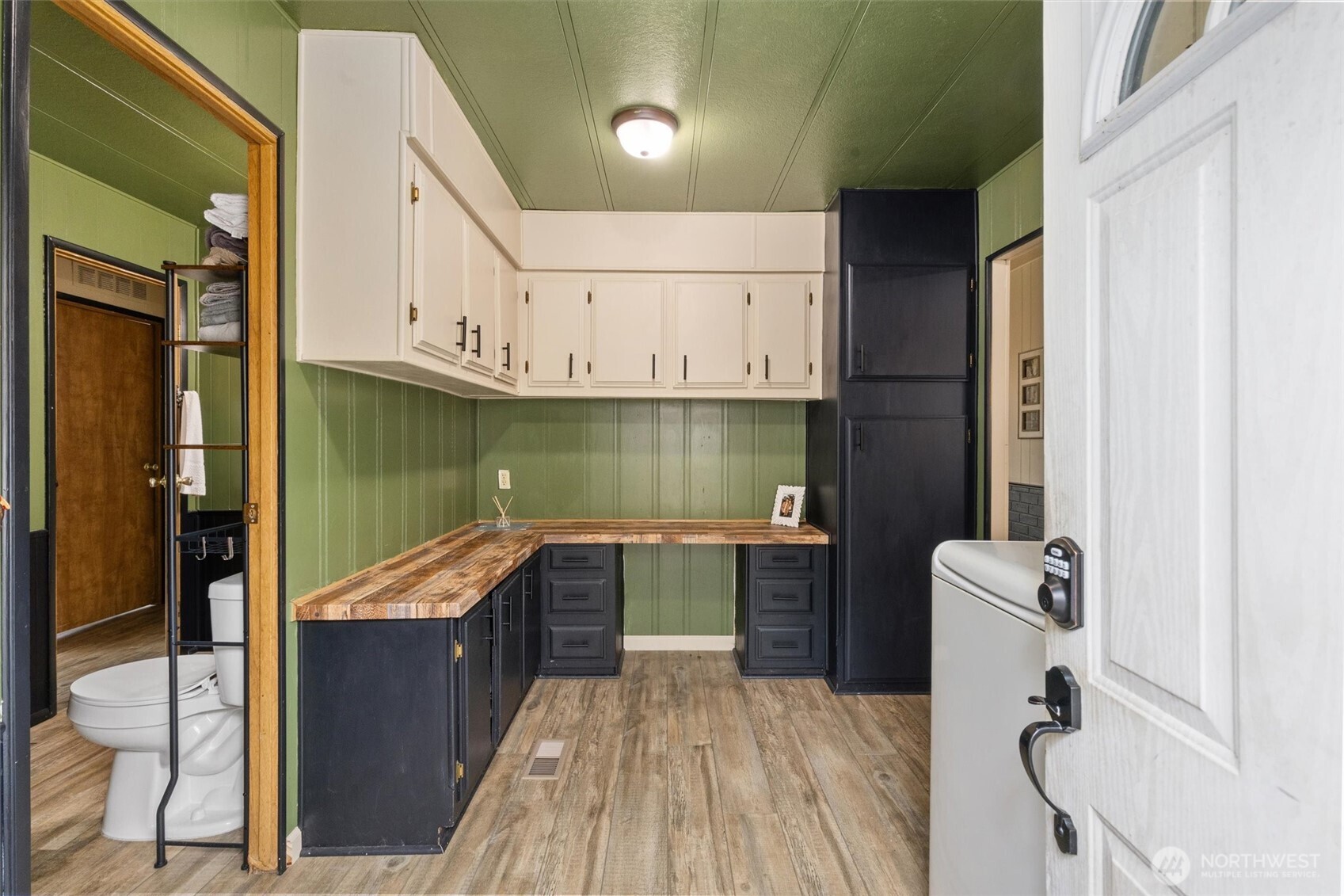 14601 Jim Creek Road Arlington, WA 98223 - Photo 22 of 35 a kitchen with a sink appliances and cabinets