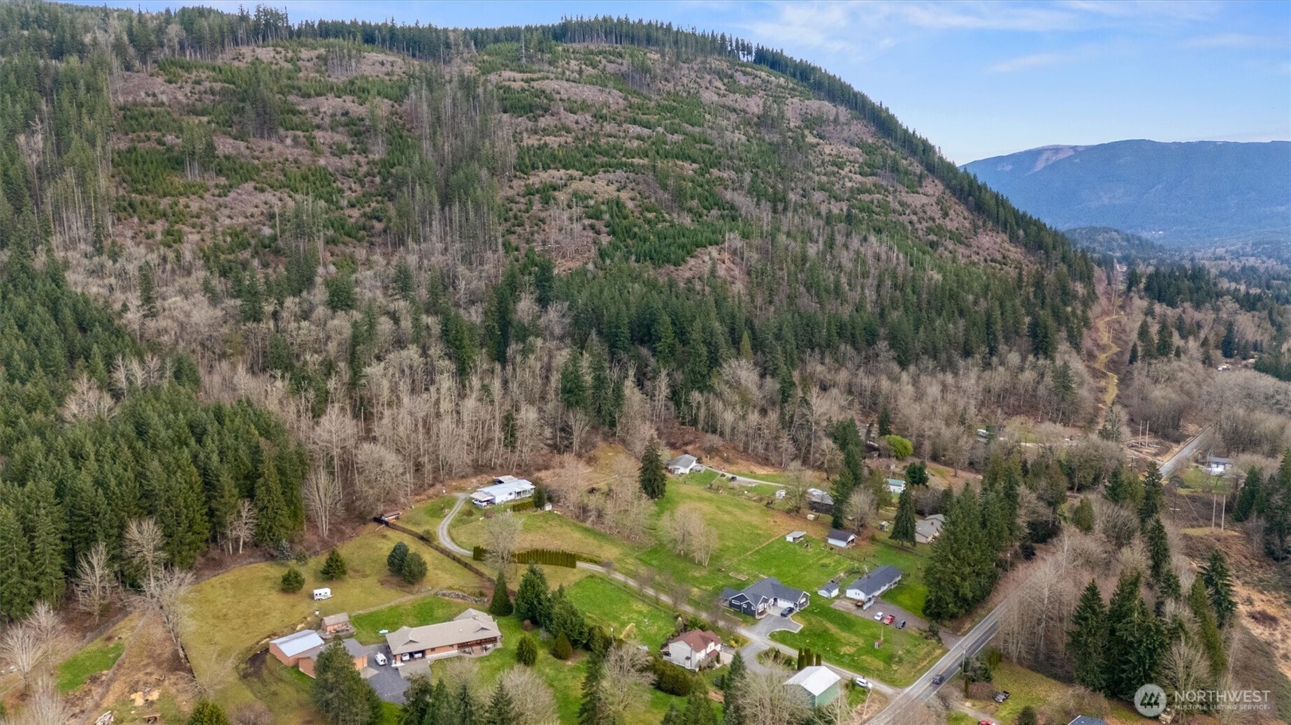 14601 Jim Creek Road Arlington, WA 98223 - Photo 29 of 35 a view of a lush green hillside and a mountain