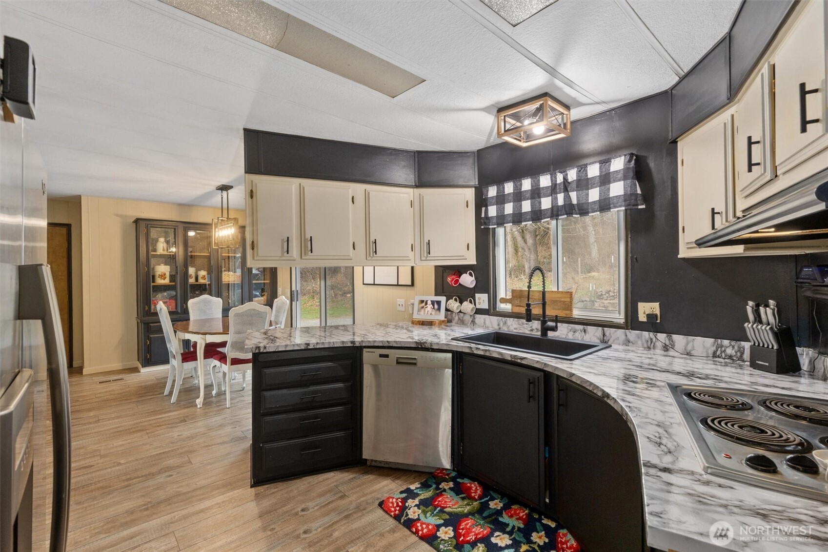 14601 Jim Creek Road Arlington, WA 98223 - Photo 6 of 35 a kitchen with granite countertop a sink stove and cabinets