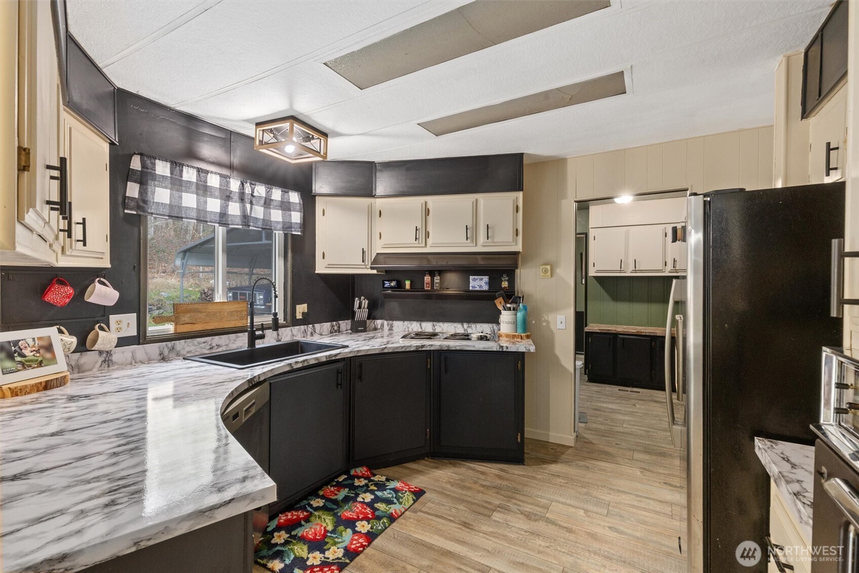 14601 Jim Creek Road Arlington, WA 98223 - Photo 7 of 35 a kitchen with granite countertop a refrigerator and a sink
