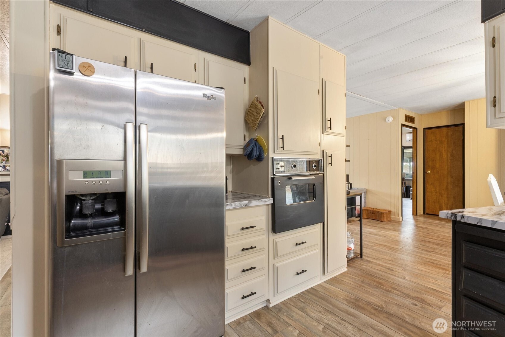 14601 Jim Creek Road Arlington, WA 98223 - Photo 8 of 35 a kitchen with stainless steel appliances a refrigerator and a stove