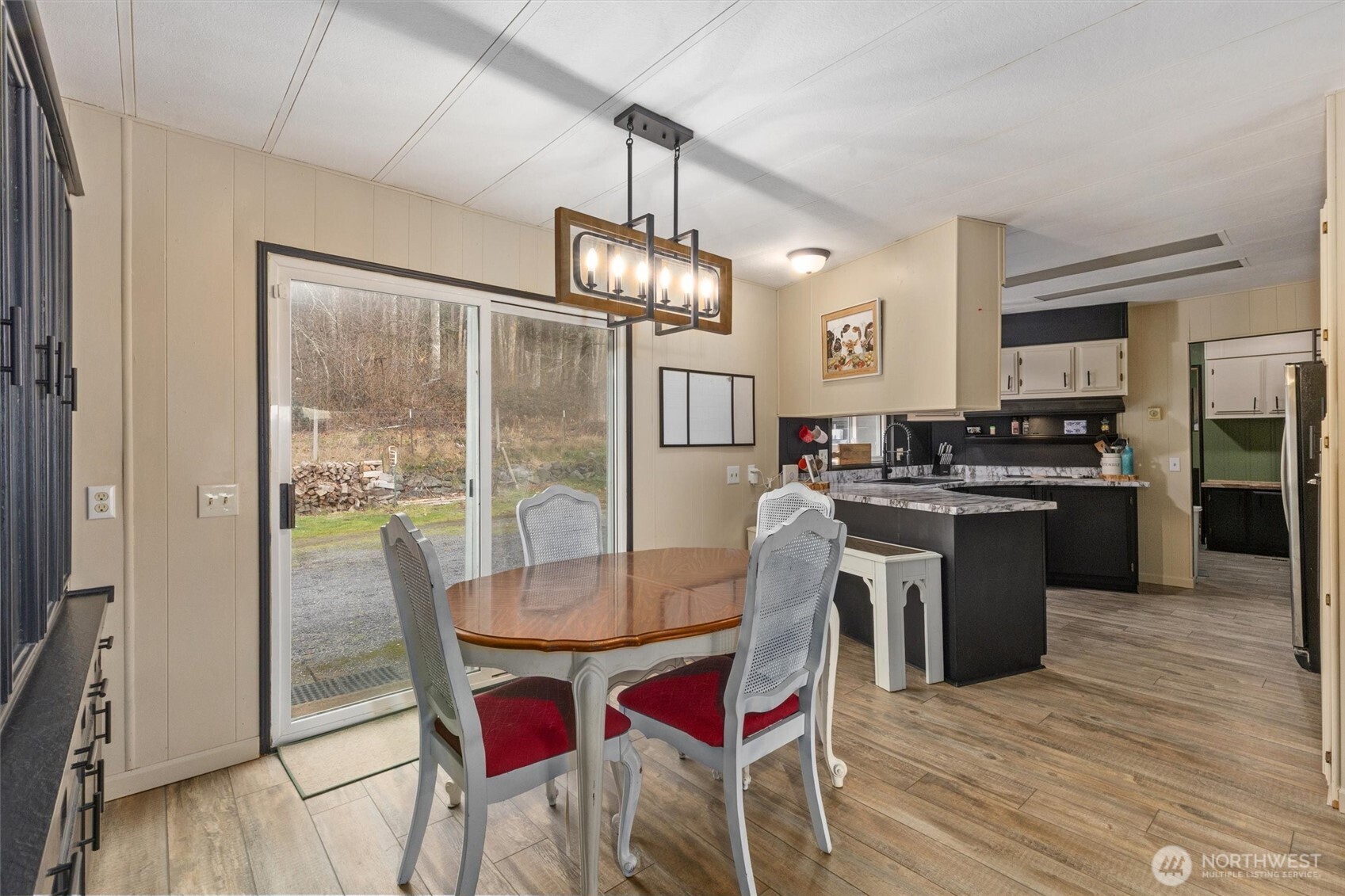 14601 Jim Creek Road Arlington, WA 98223 - Photo 9 of 35 a kitchen with a table chairs stainless steel appliances and cabinets