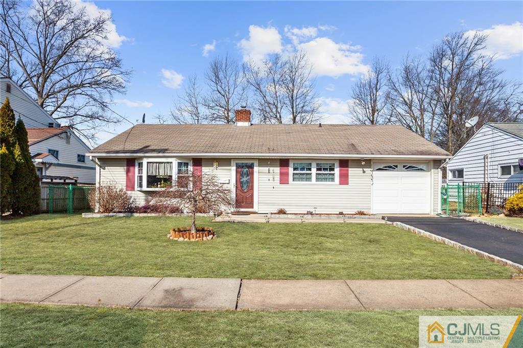 156 Winthrop Road Edison, NJ 08817 - Photo 1 of 28 a front view of a house with a yard