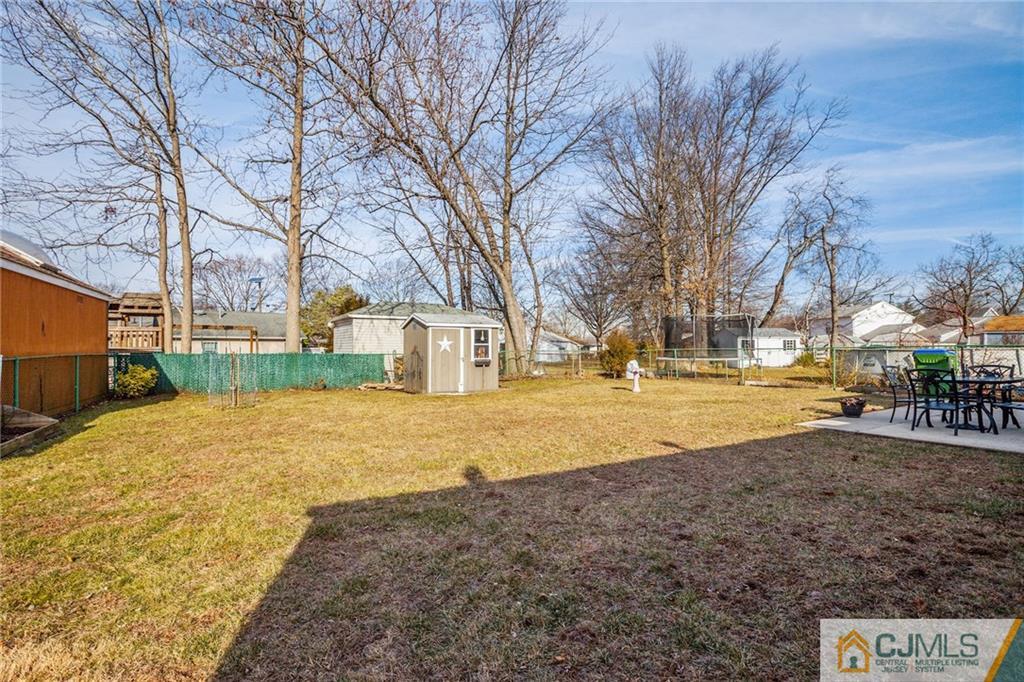 156 Winthrop Road Edison, NJ 08817 - Photo 14 of 28 a view of yard with swimming pool and trees