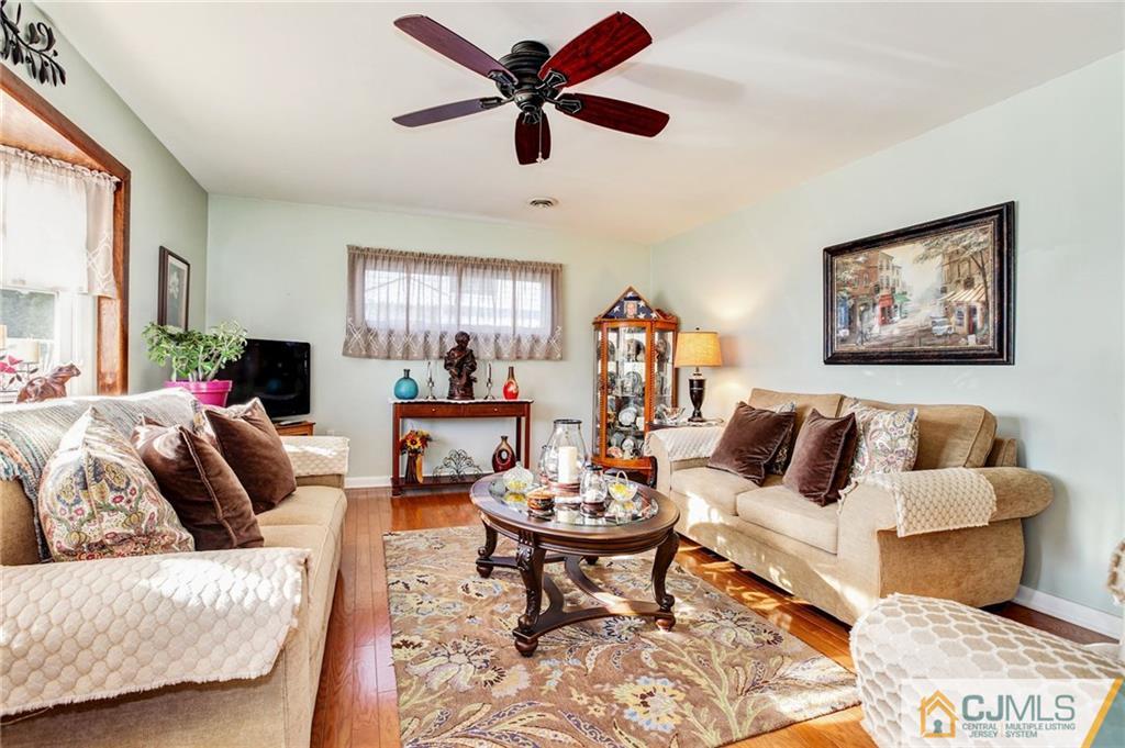 156 Winthrop Road Edison, NJ 08817 - Photo 17 of 28 a living room with furniture a rug and a large window