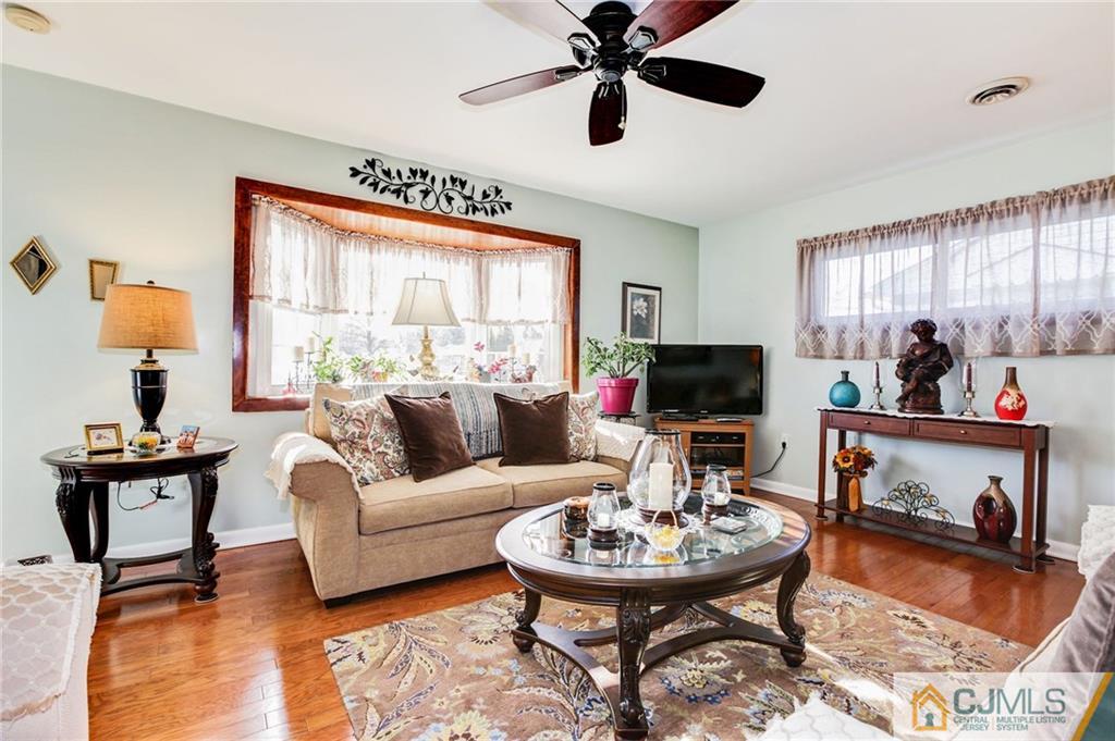 156 Winthrop Road Edison, NJ 08817 - Photo 18 of 28 a living room with furniture and a flat screen tv