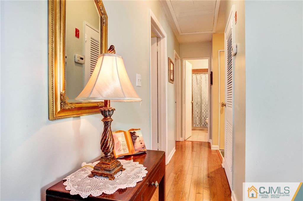 156 Winthrop Road Edison, NJ 08817 - Photo 22 of 28 a view of a room with wooden floor and windows