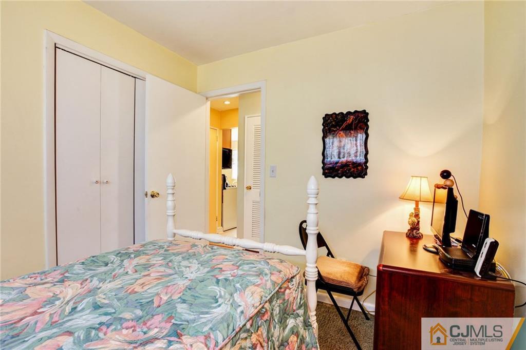 156 Winthrop Road Edison, NJ 08817 - Photo 23 of 28 a bedroom with a bed and wooden floor