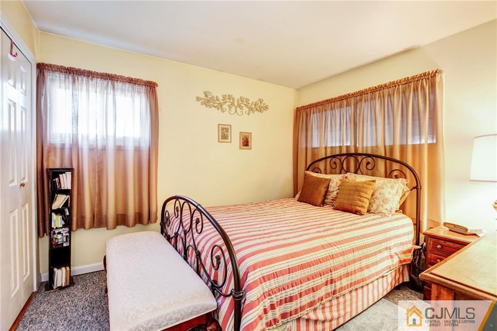 156 Winthrop Road Edison, NJ 08817 - Photo 24 of 28 a bedroom with a bed and a walk in closet