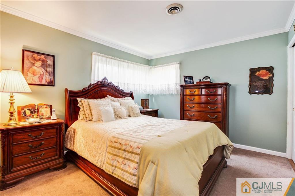 156 Winthrop Road Edison, NJ 08817 - Photo 4 of 28 a bedroom with a bed and closet