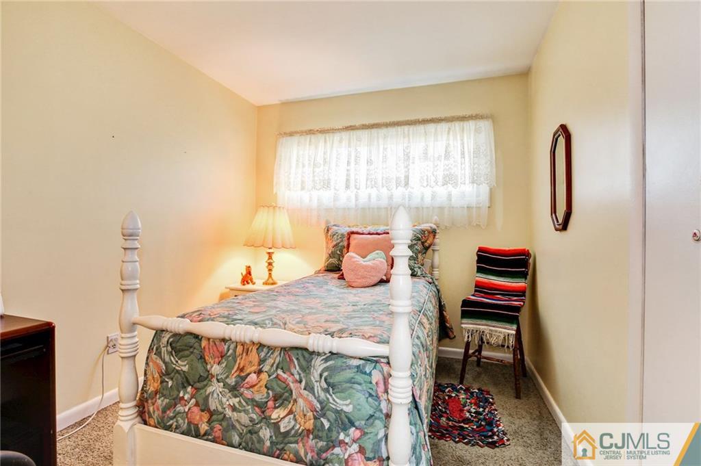 156 Winthrop Road Edison, NJ 08817 - Photo 5 of 28 a bedroom with a bed and a dresser