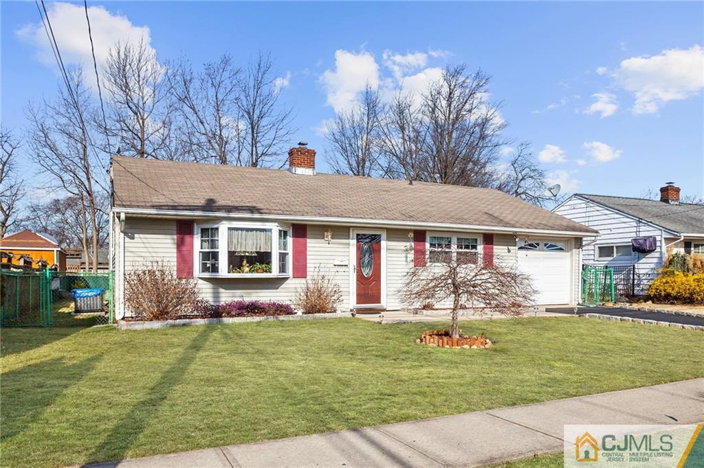 156 Winthrop Road Edison, NJ 08817 - Photo 10 of 28 a front view of a house with a yard