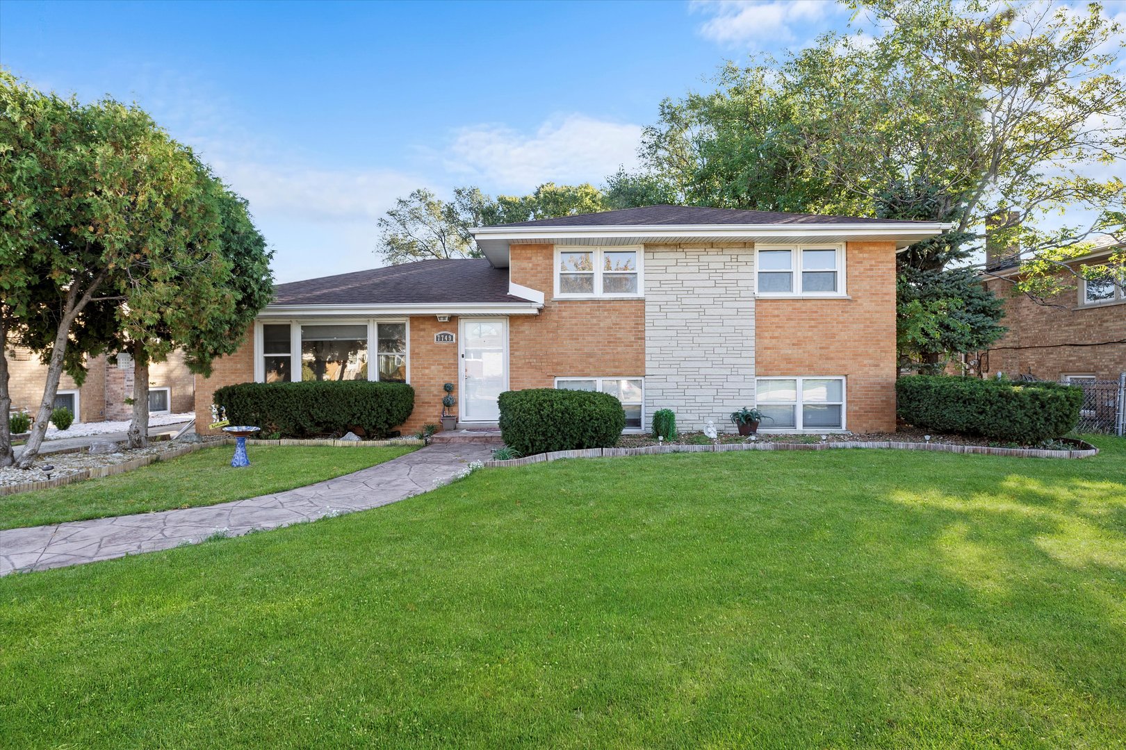 7749 South Octavia Avenue Bridgeview, IL 60455 - Photo 1 of 35 a front view of house with yard and green space