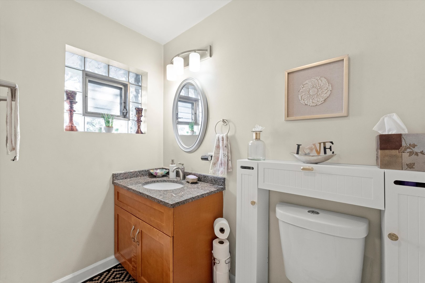 7749 South Octavia Avenue Bridgeview, IL 60455 - Photo 19 of 35 a room with a sink and a mirror