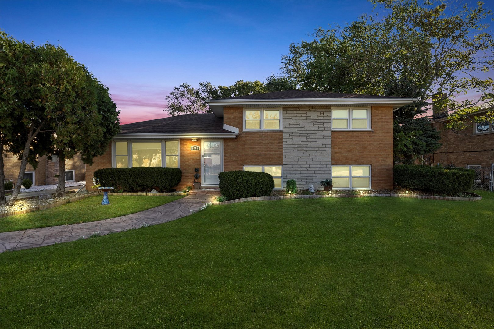 7749 South Octavia Avenue Bridgeview, IL 60455 - Photo 2 of 35 a view of house with a yard