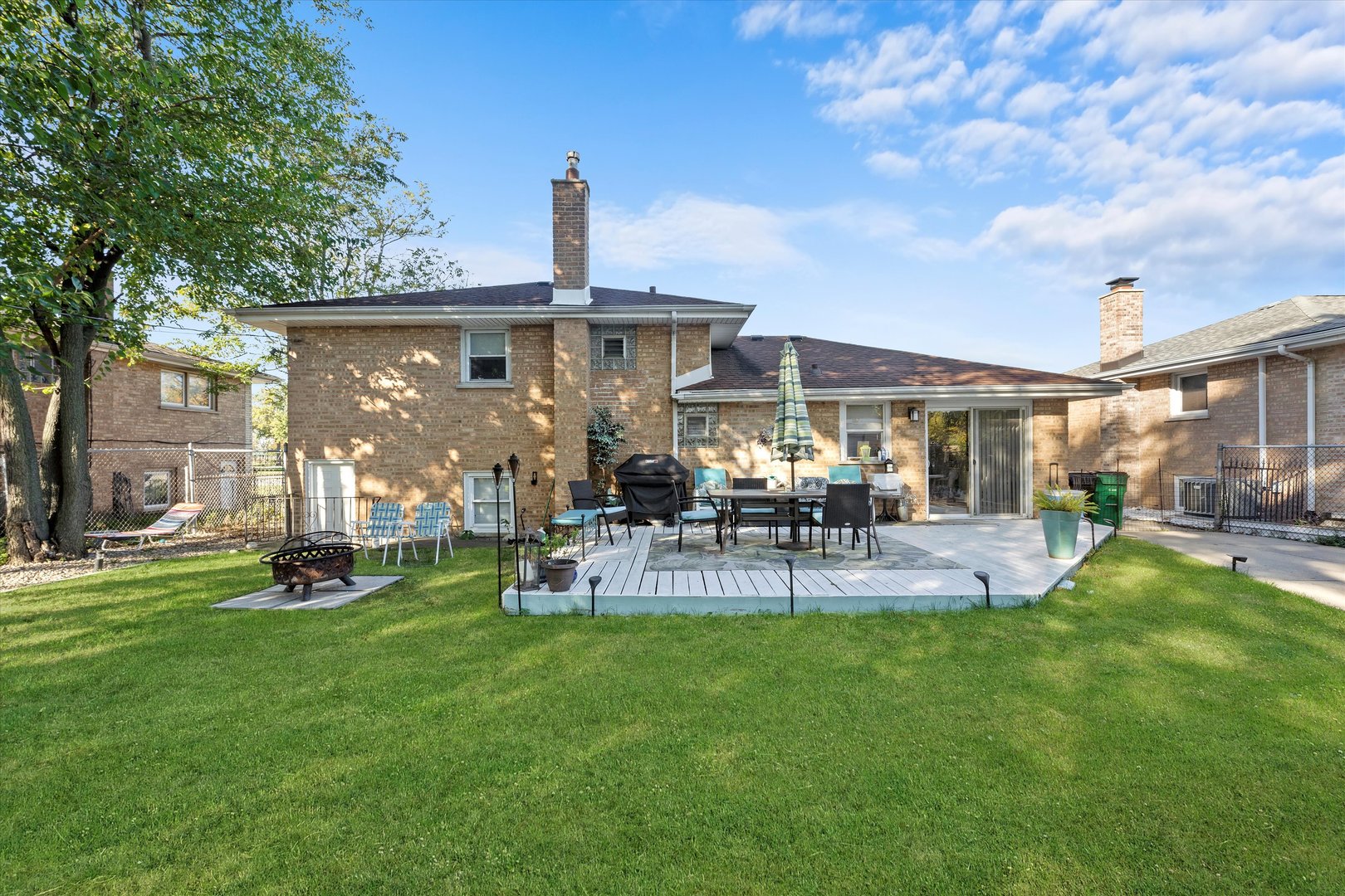 7749 South Octavia Avenue Bridgeview, IL 60455 - Photo 27 of 35 a view of a house with a yard and sitting area