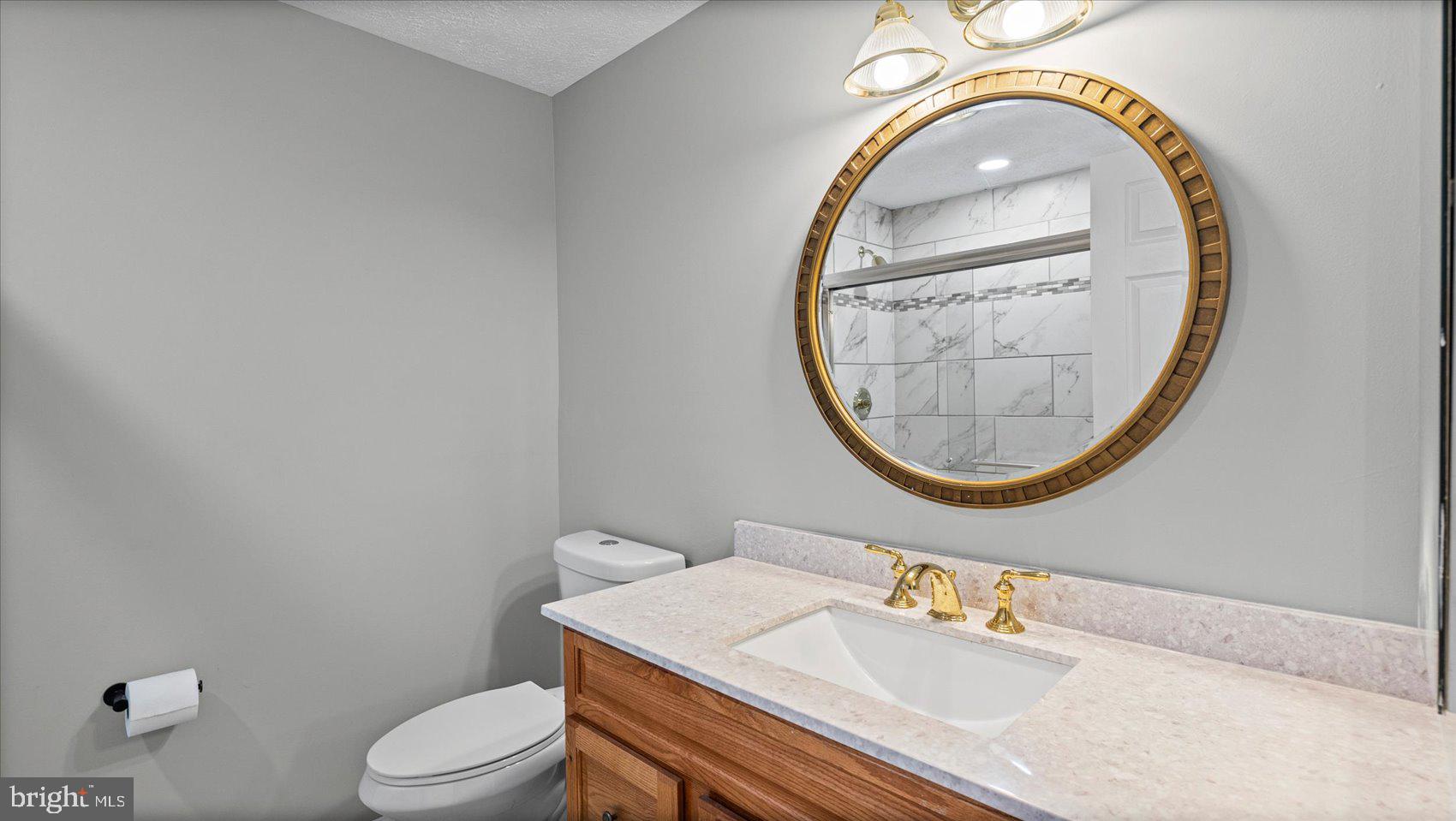 3709 Redberry Way Nottingham, MD 21236 - Photo 29 of 45 a bathroom with a sink and a mirror