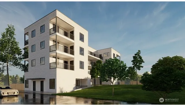 a front view of a building with a yard