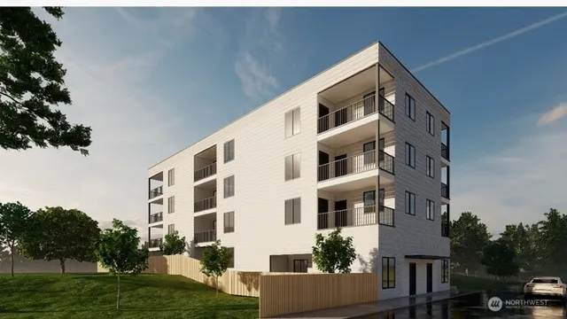 a front view of a building with a yard