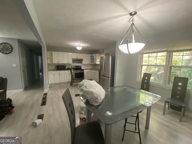 a view of a dining room with furniture window and outside view