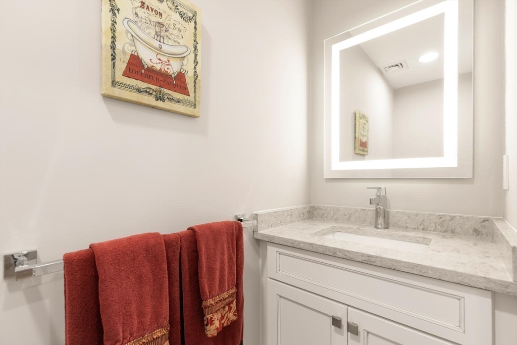 7 Whitman Street, Unit 1 Somerville, MA 02144 - Photo 13 of 35 a bathroom with a sink and a mirror