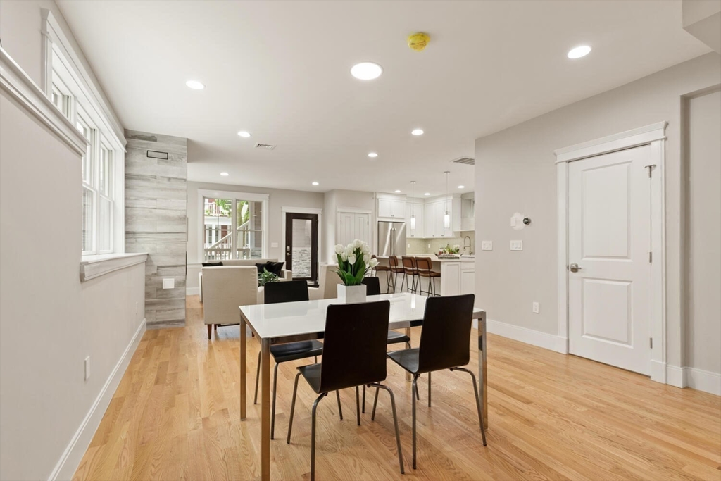 7 Whitman Street, Unit 1 Somerville, MA 02144 - Photo 14 of 35 a view of a dining room with furniture and wooden floor