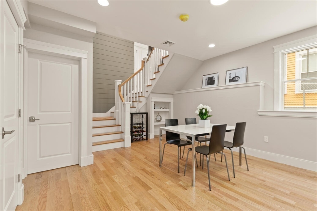 7 Whitman Street, Unit 1 Somerville, MA 02144 - Photo 15 of 35 a view of a dining room with furniture and wooden floor