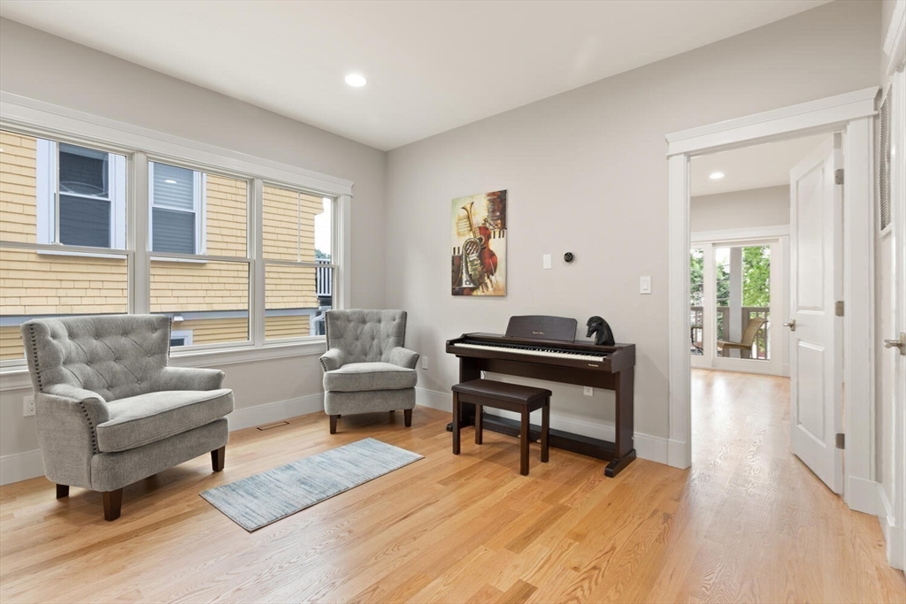 7 Whitman Street, Unit 1 Somerville, MA 02144 - Photo 26 of 35 a living room with furniture and a wooden floor