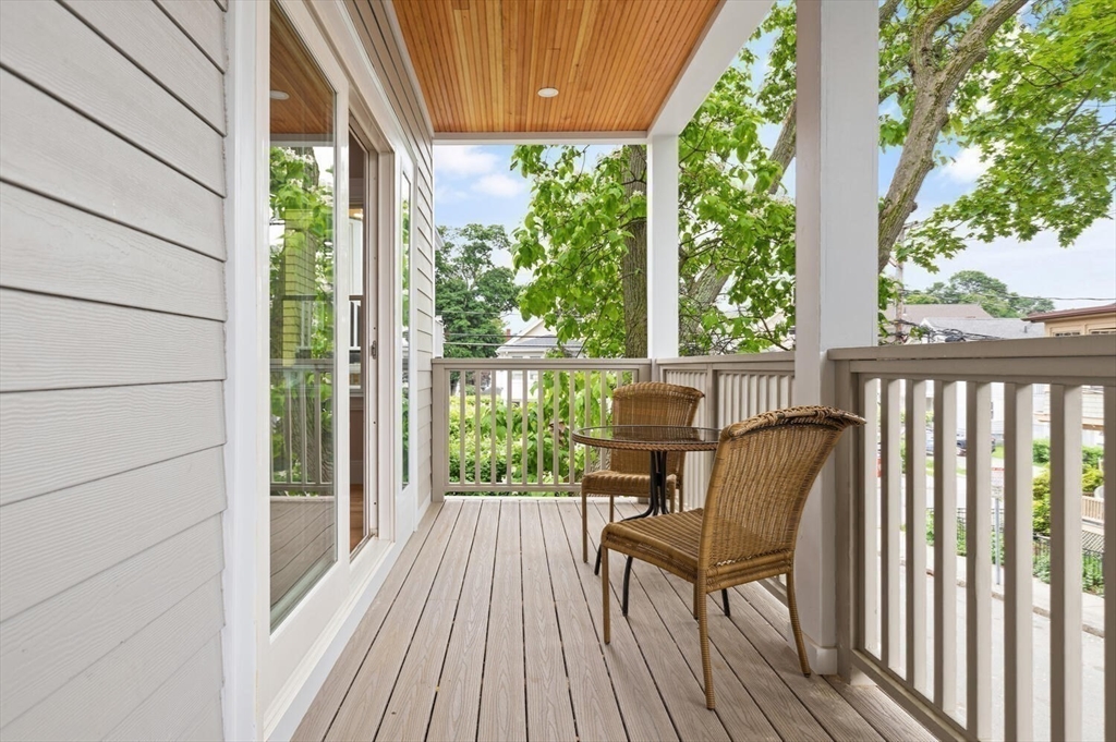 7 Whitman Street, Unit 1 Somerville, MA 02144 - Photo 29 of 35 a view of balcony with wooden floor and outdoor seating