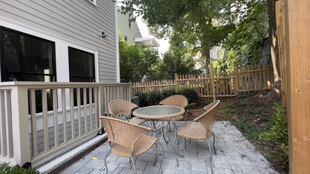 7 Whitman Street, Unit 1 Somerville, MA 02144 - Photo 30 of 35 a view of a chair in wooden deck