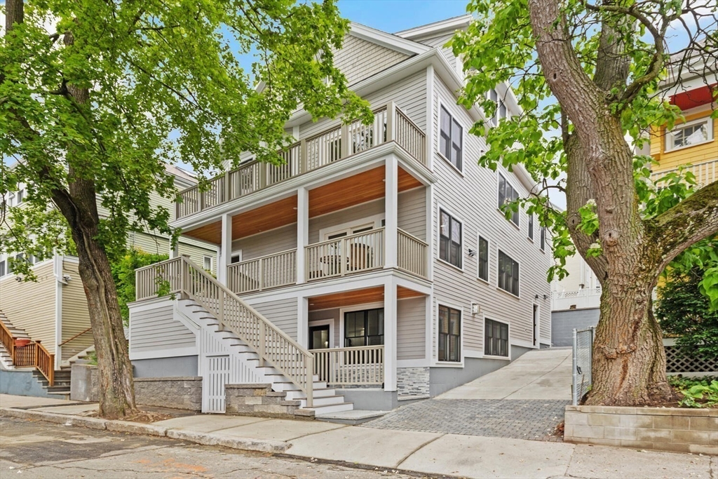 7 Whitman Street, Unit 1 Somerville, MA 02144 - Photo 35 of 35 a front view of a house with a tree