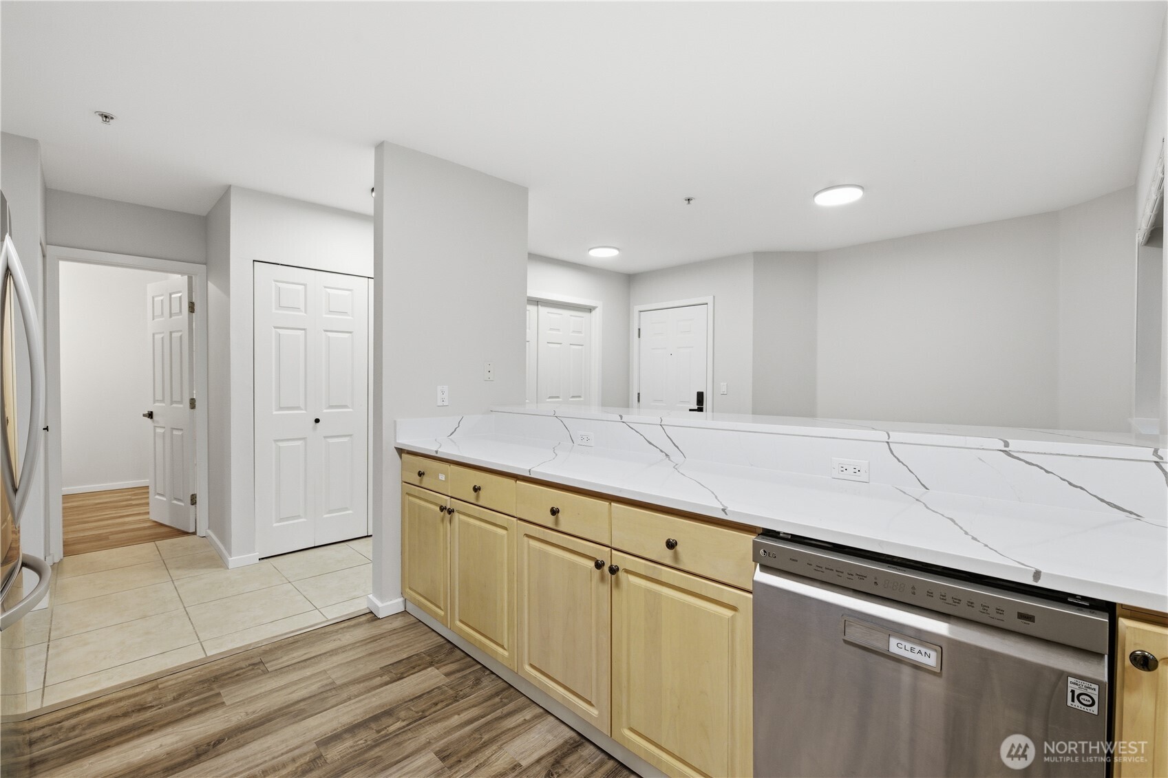 15340 Macadam Road South, Unit B206 Tukwila, WA 98188 - Photo 11 of 29 a view of a kitchen with white cabinets