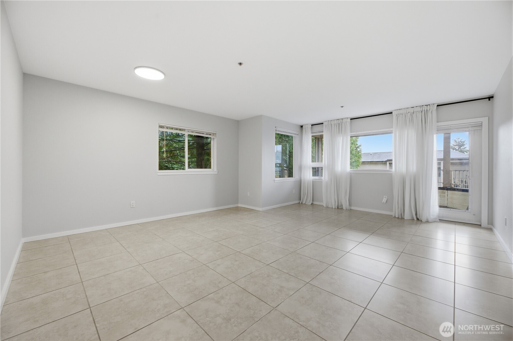 15340 Macadam Road South, Unit B206 Tukwila, WA 98188 - Photo 14 of 29 a view of an empty room with a window