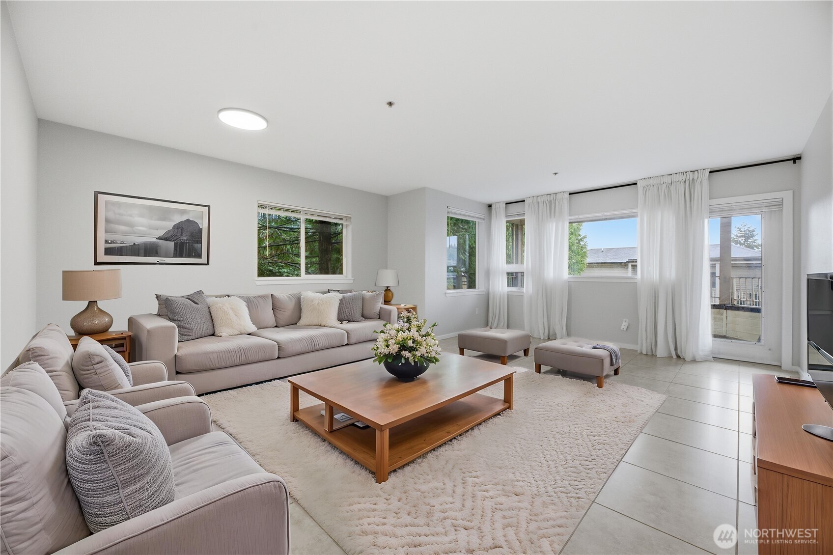 15340 Macadam Road South, Unit B206 Tukwila, WA 98188 - Photo 15 of 29 a living room with furniture and a view of kitchen