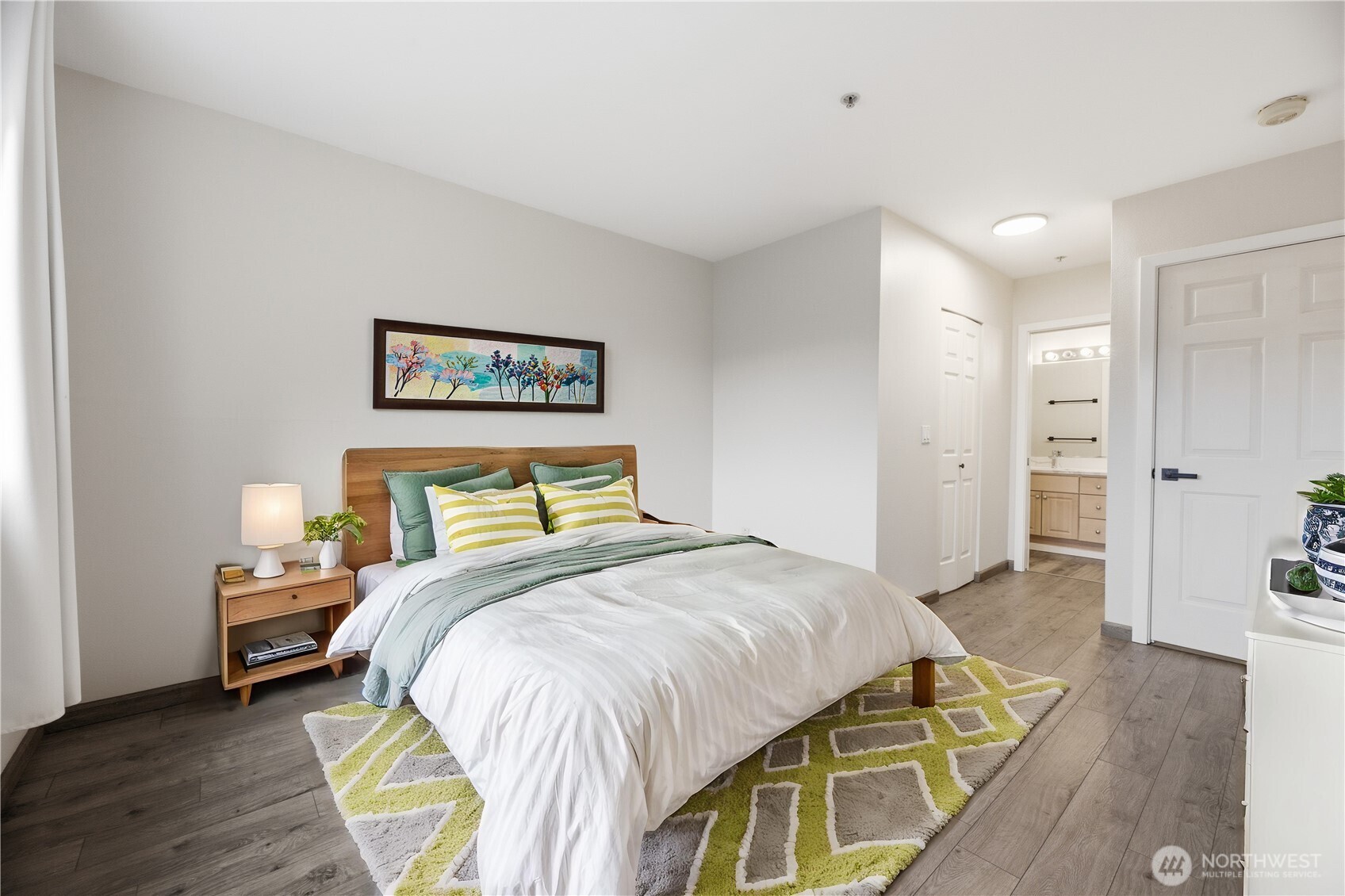 15340 Macadam Road South, Unit B206 Tukwila, WA 98188 - Photo 22 of 29 a bedroom with a bed and a table