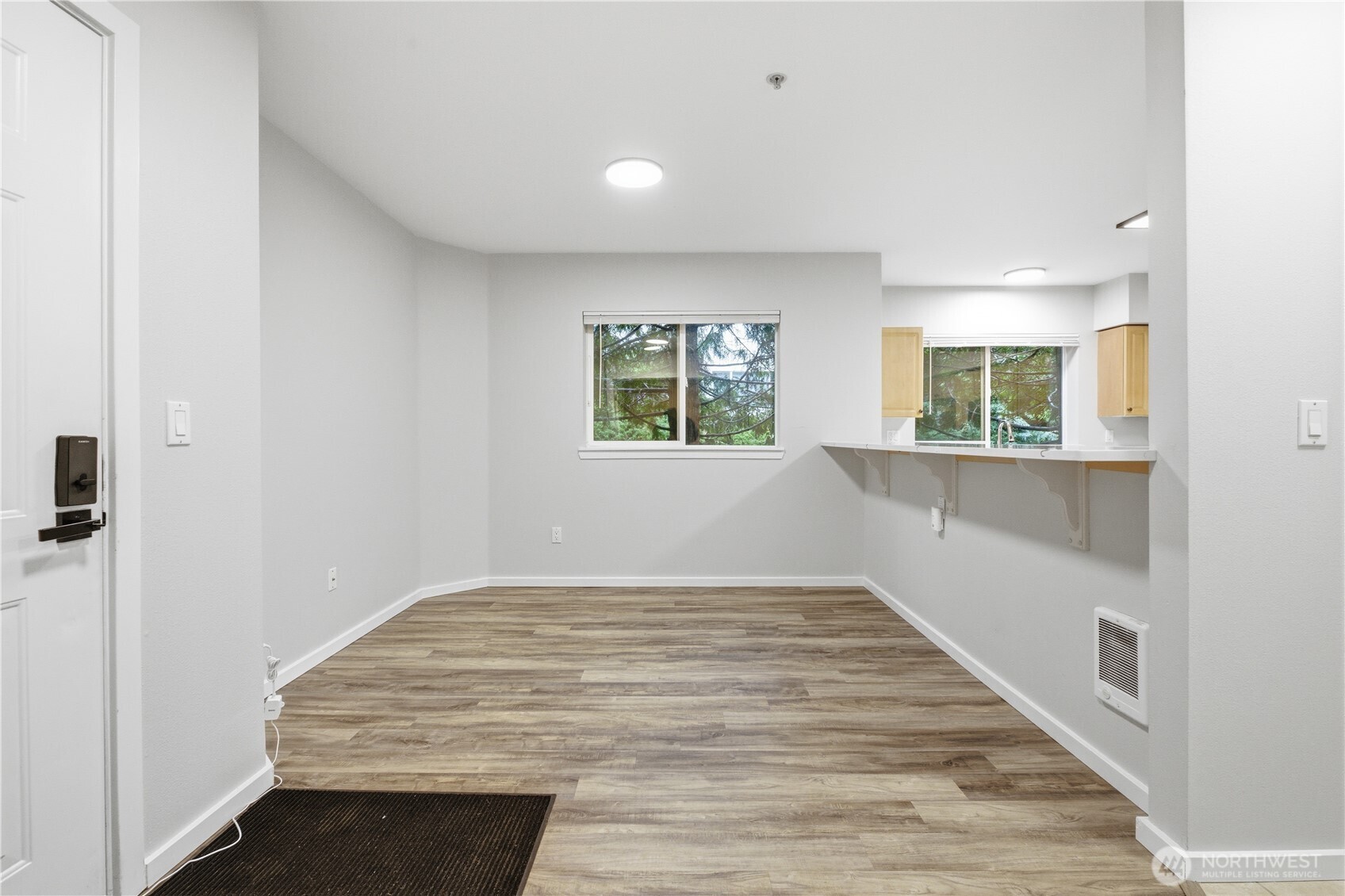 15340 Macadam Road South, Unit B206 Tukwila, WA 98188 - Photo 3 of 29 wooden floor in an empty room with a window