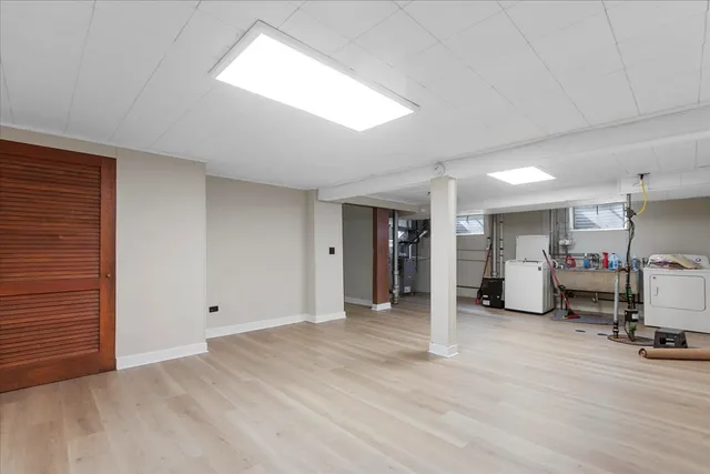 a view of a room with gym equipment and a window