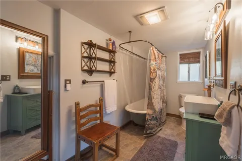 a view of kitchen and sink with wooden floor