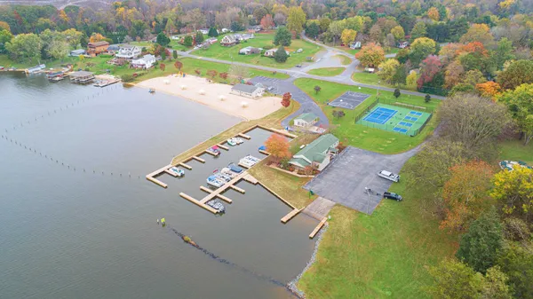 an aerial view of a house with a lake view