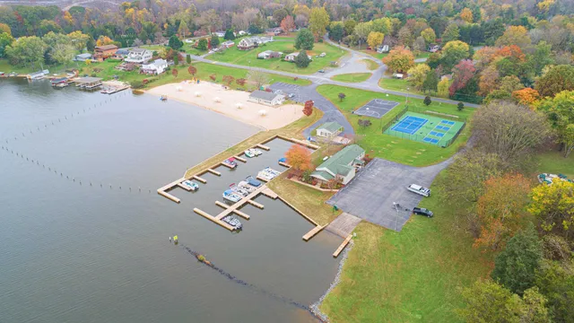 an aerial view of a house with a lake view